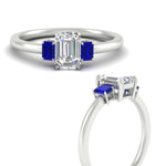 Load image into Gallery viewer, 0.25-ct-emerald-cut-three-stone-sapphire-engagement-ring-in-white-gold-fdenr9299emgsablangle3-0.25ct-nl-wg.jpg