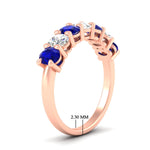 Load image into Gallery viewer, 1.50-carat-seven-stone-oval-sapphire-anniversary-band-in-rose-gold-fdwb8008ovgsablangle2-1.50ct-nl-rg-hw