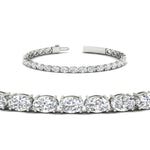 Load image into Gallery viewer, 10-ct-oval-diamond-basket-tennis-bracelet-in-white-gold-fdbrc10444angle2-10.00-ct-nl-wg