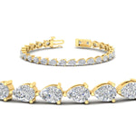 Load image into Gallery viewer, 10-carat-pear-shape-diamond-tennis-bracelet-in-yellow-gold-FDBRC11577angle2-nl-yg.jpg?v=1776416320