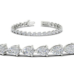 Load image into Gallery viewer, 10-carat-pear-shape-east-west-diamond-tennis-bracelet-in-platinum-FDBRC11577angle2-nl-wg.jpg?v=1776416388
