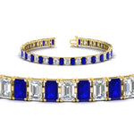 Load image into Gallery viewer, 14-ct-emerald-cut-sapphire-tennis-diamond-bracelet-in-yellow-gold-FDBRC10449EMGSABLANGLE2-14.00CT-NL-YG.jpg