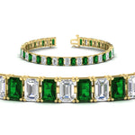Load image into Gallery viewer, 17-ct-emerald-cut-tennis-diamond-bracelet-basket-set-with-emerald-in-yellow-gold-FDBRC10449EMGEMGRANGLE2-17.00CT-NL-YG.jpg
