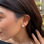 Load image into Gallery viewer, 1ct-round-stud-earrings-white-gold-fdear10411ro-1-ct-model.jpg?v=1763443498
