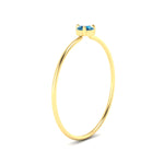 Load image into Gallery viewer, 3-prong-round-blue-topaz-tiny-band-ring-in-yellow-gold-fd9389gicbltoangle2-nl-yg.jpg?v=1756441995