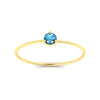 Load image into Gallery viewer, 3-prong-round-blue-topaz-tiny-band-ring-in-yellow-gold-fd9389gicbltoangle5-nl-yg.jpg?v=1756441995