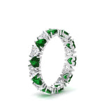 Load image into Gallery viewer, 4-carat-heart-eternity-diamond-anniversary-band-with-emerald-in-white-gold-FDEWB8439GEMGRANGLE2-NL-WG