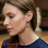 Load image into Gallery viewer, 4-ct-emerald-cut-diamond-drop-earrings-in-yellow-gold-fdear11236em-model