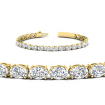 Load image into Gallery viewer, basket-tennis-bracelet-14-carat-oval-shaped-in-yellow-gold-fdbrc10444angle2-14.00ct-nl-yg