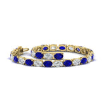 Load image into Gallery viewer, basket-tennis-bracelet-14-carat-oval-shaped-in-yellow-gold-fdbrc10444gsablangle2-14.00ct-nl-yg