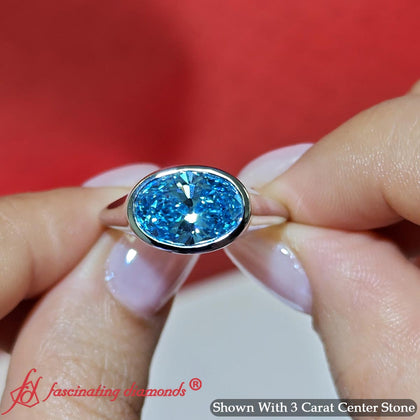 Horizontal Fancy Vivid Blue Lab Bezel Oval Diamond Solitaire Ring