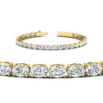 Load image into Gallery viewer, oval-shaped-13-carat-basket-tennis-bracelet-in-yellow-gold-fdbrc10444angle2-13.00-ct-nl-yg