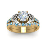 Load image into Gallery viewer, celtic-cushion-cut-diamond-wedding-ring-set-with-blue-topaz-in-yellow-gold-FDENS2255B1CUGICBLTOANGLE5-NL-YG_06636bd3-8504-4c0e-b543-a2ce21e9bfff?v=1757065024
