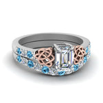 Load image into Gallery viewer, celtic-emerald-cut-diamond-wedding-ring-set-with-blue-topaz-in-white-gold-FDENS2255B1EMGICBLTO-NL-WG_a94a3dc9-27d2-4d66-b395-5aa812e7cf5e?v=1757056978