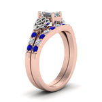 Load image into Gallery viewer, celtic-emerald-cut-diamond-wedding-ring-set-with-sapphire-in-rose-gold-FDENS2255B1EMGSABLANGLE2-NL-RG?v=1757056978