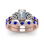 Load image into Gallery viewer, celtic-emerald-cut-diamond-wedding-ring-set-with-sapphire-in-rose-gold-FDENS2255B1EMGSABLANGLE5-NL-RG_09bc469c-31ac-4373-960e-96ebad273c4c?v=1757056977