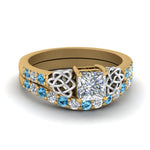 Load image into Gallery viewer, celtic-princess-cut-diamond-wedding-ring-set-with-blue-topaz-in-yellow-gold-FDENS2255B1PRGICBLTO-NL-YG?v=1757056921