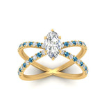 Load image into Gallery viewer, cross-band-marquise-cut-engagment-ring-with-blue-topaz-yellow-gold-FD9890MQRGICBLTOANGLE5-NL-YG_c2c14441-b359-41ee-b557-d1f8075b1994.jpg?v=1760525899