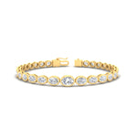 Load image into Gallery viewer, east-west-oval-bezel-tennis-bracelet-in-yellow-gold-fdbrc11733sleep-nl-yg.jpg?v=1776314672