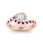 Load image into Gallery viewer, east-west-oval-sapphire-wedding-band-ring-set-in-rose-gold-fdens7806ovgsablangle5-nl-rg_f02eb67f-f6e1-4c0c-8f8d-c48630be26a7.jpg?v=1759992100
