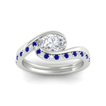 Load image into Gallery viewer, east-west-oval-sapphire-wedding-band-ring-set-in-white-gold-fdens7806ovgsablangle5-nl-wg.jpg?v=1759991829