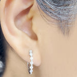 Load image into Gallery viewer, floating-bezel-diamond-huggie-earring-in-white-gold-fdsder01023-fancy-nl-wg