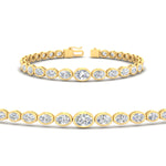 Load image into Gallery viewer, graduated-bezel-oval-diamond-tennis-bracelet-in-yellow-gold-fdbrc11733angle2-nl-yg.jpg?v=1776314660