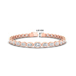 Load image into Gallery viewer, graduated-bezel-oval-east-west-tennis-bracelet-in-rose-gold-fdbrc11733sleep-nl-rg-hw.jpg?v=1776313785