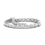 Load image into Gallery viewer, graduated-bezel-oval-east-west-tennis-bracelet-in-white-gold-fdbrc11733angle4-nl-wg.jpg?v=1776313785