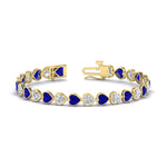 Load image into Gallery viewer, heart-shaped-diamond-bezel-tennis-bracelet-10-40-carat-with-sapphire-in-yellow-gold-fdbrc10581htgsablangle2-10-40-ct-nl-yg