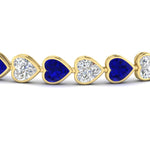 Load image into Gallery viewer, heart-shaped-diamond-bezel-tennis-bracelet-10-40-carat-with-sapphire-in-yellow-gold-fdbrc10581htgsablangle2-10-40-ct-nl-yg