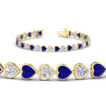 Load image into Gallery viewer, heart-shaped-diamond-bezel-tennis-bracelet-7-75-carat-with-sapphire-in-yellow-gold-fdbrc10581htgsablangle2-7-75-ct-nl-yg