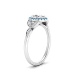 Load image into Gallery viewer, leaves-oval-shaped-halo-diamond-engagement-ring-with-blue-topaz-in-white-gold-FD9827OVRGICBLTOANGLE2-NL-WG.jpg?v=1770891254