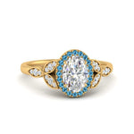 Load image into Gallery viewer, leaves-oval-shaped-halo-diamond-engagement-ring-with-blue-topaz-in-yellow-gold-FD9827OVRGICBLTO-NL-YG.jpg?v=1770891254