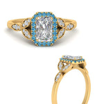 Load image into Gallery viewer, leaves-radiant-cut-halo-diamond-engagement-ring-with-blue-topaz-in-yellow-gold-FD9827RARGICBLTOANGLE3-NL-YG.jpg?v=1770891304