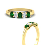 Load image into Gallery viewer, oval-cut-five-stone-wedding-emerald-band-0.50-carat-in-yellow-gold-fdwb8008ovgemgrangle3-0.50ct-nl-yg.jpg?v=1773047587