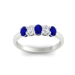 Load image into Gallery viewer, oval-cut-five-stone-wedding-sapphire-band-0.50-carat-in-white-gold-fdwb8008ovgsablangle5-0.50ct-nl-wg_6250320b-899f-49e4-98c7-3adc710a482a.jpg?v=1773047587