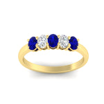 Load image into Gallery viewer, oval-cut-five-stone-wedding-sapphire-band-0.50-carat-in-yellow-gold-fdwb8008ovgsablangle5-0.50ct-nl-yg.jpg?v=1773047588