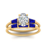 Load image into Gallery viewer, oval-shaped-bar-set-sapphire-ring-with-matching-3-baguette-wedding-band-in-yellow-gold-FDENS100OVGSABLANGLE5-NL-YG
