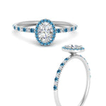 Load image into Gallery viewer, oval-shaped-blue-topaz-halo-petite-engagement-ring-in-white-gold-FD8523OVRGICBLTOANGLE3-NL-WG