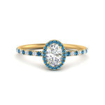 Load image into Gallery viewer, oval-shaped-blue-topaz-halo-petite-engagement-ring-in-yellow-gold-FD8523OVRGICBLTOANGLE3-NL-YG