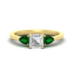 Load image into Gallery viewer, pear-diamond-cathedral-asscher-cut-engagement-ring-with-emerald-in-yellow-gold-fdenr9210asrgemgrsleep-nl-yg_8e205dc6-93f7-4178-b5b0-8263d944331c.jpg?v=1758259331