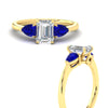 Load image into Gallery viewer, pear-diamond-cathedral-emerald-cut-engagement-ring-with-sapphire-in-yellow-gold-fdenr9210emrgsablangle3-nl-yg.jpg?v=1758097711