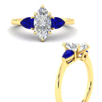 Load image into Gallery viewer, pear-diamond-cathedral-marquise-cut-engagement-ring-with-sapphire-in-yellow-gold-fdenr9210mqrgsablangle3-nl-yg.jpg?v=1758088286