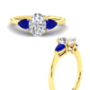 Load image into Gallery viewer, pear-diamond-cathedral-oval-shaped-engagement-ring-with-sapphire-in-yellow-gold-fdenr9210ovrgsablangle3-nl-yg.jpg?v=1758087322