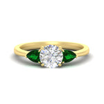 Load image into Gallery viewer, pear-diamond-cathedral-round-cut-engagement-ring-with-emerald-in-yellow-gold-fdenr9210rorgemgrsleep-nl-yg