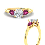Load image into Gallery viewer, pear-diamond-cathedral-round-cut-engagement-ring-with-pink-sapphire-in-yellow-gold-fdenr9210rorgsadrpiangle3-nl-yg