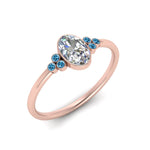 Load image into Gallery viewer, petite-bezel-set-oval-shaped-diamond-engagement-ring-with-blue-topaz-in-rose-gold-FD9175OVRGICBLTOANGLE2-NL-RG