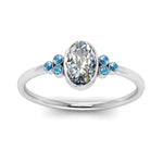 Load image into Gallery viewer, petite-bezel-set-oval-shaped-diamond-engagement-ring-with-blue-topaz-in-white-gold-FD9175OVRGICBLTOANGLE5-NL-WG