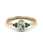 Load image into Gallery viewer, petite-bezel-set-oval-shaped-diamond-engagement-ring-with-emerald-in-yellow-gold-FD9175OVRGEMGR-NL-YG